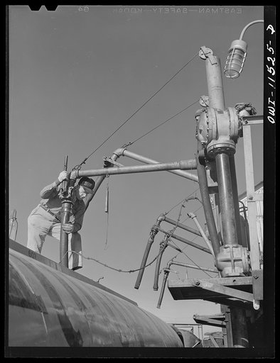 Borger, Texas. Loading a truck with gasoline for service station distribution