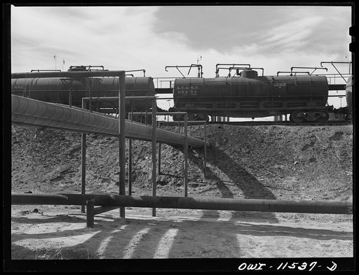 Untitled photo, possibly related to: Phillips refinery. Borger, Texas. Pipelines leading from the storage tanks to the loading rack