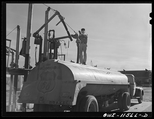 Untitled photo, possibly related to: Borger, Texas. Loading a truck with gasoline for service station distribution