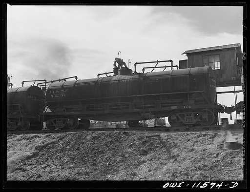 Untitled photo, possibly related to: Phillips refinery. Borger, Texas. Loading a tank car