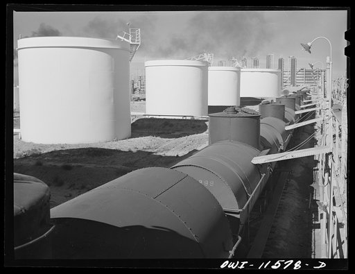 Phillips gasoline plant. Borger, Texas. Storage tank and tank cars
