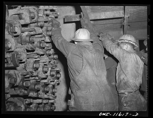Untitled photo, possibly related to: Phillips refinery. Borger, Texas. Repairing a still