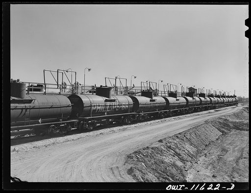 Untitled photo, possibly related to: Borger, Texas. Loading tank cars at Phillips gasoline plant