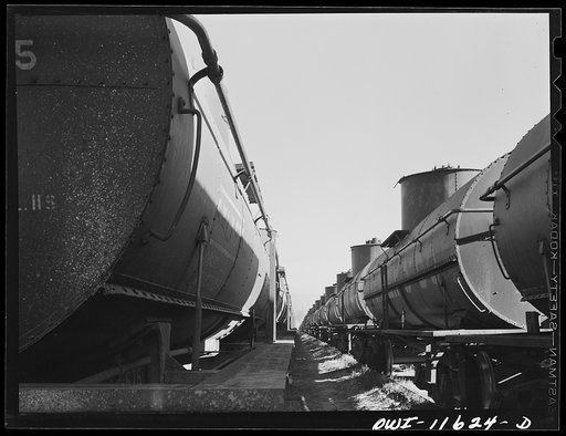 Untitled photo, possibly related to: Borger, Texas. Loading tank cars at Phillips gasoline plant