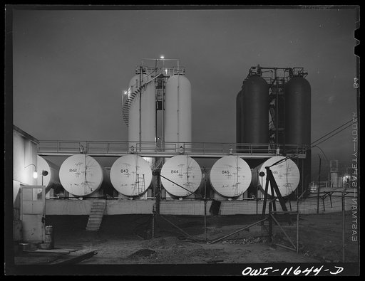 Phillips refinery. Borger, Texas. Storage tanks at night