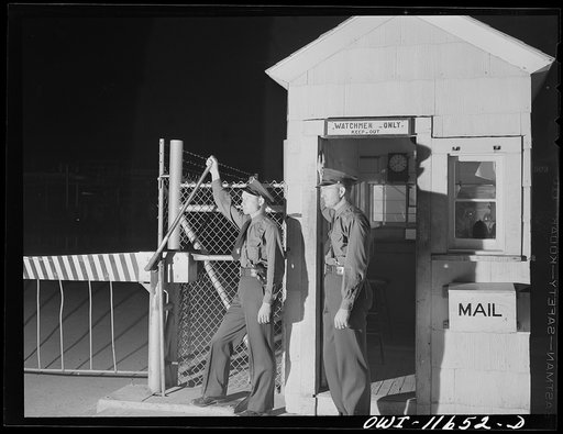 Borger, Texas. Guards at entrance to gasoline plant