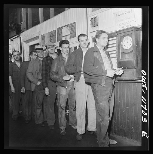 Lititz, Pennsylvania. Employees in the Animal Trap Company machine shop checking out for lunch