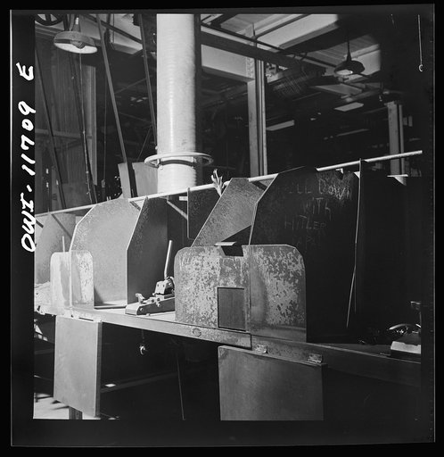 Untitled photo, possibly related to: Lititz, Pennsylvania. Section of the Animal Trap Company where traps were made before conversion to produce bullets is almost entirely idle; it contains occasional anti-Axis inscription