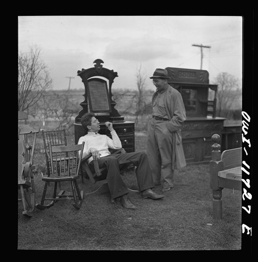 Untitled photo, possibly related to: Lititz, Pennsylvania. Looking over the furniture at a public sale before bidding