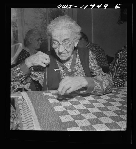 Lititz, Pennsylvania. The oldest member of the Moravian sewing circle is in her nineties. Members of the circle quilt for anyone who wants it at the cost of one cent a yard of thread, and the money goes to the church