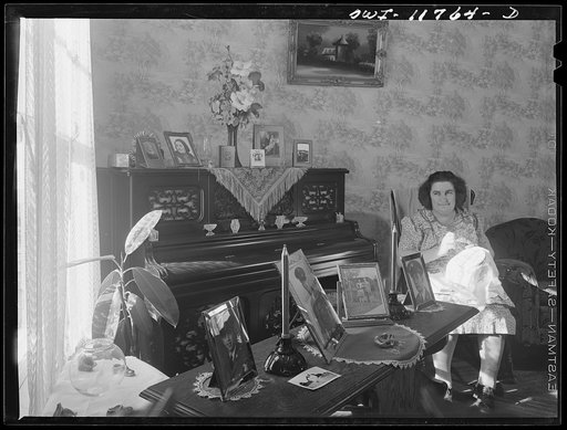 Lititz, Pennsylvania. Mrs. R.W. (Elizabeth) Almoney in her living room, with pictures of her relatives in the service. She has one son in the U.S. Army Air Corps in Mississippi, one in a tank division in Texas, another in the Engineer Corps in Hawaii