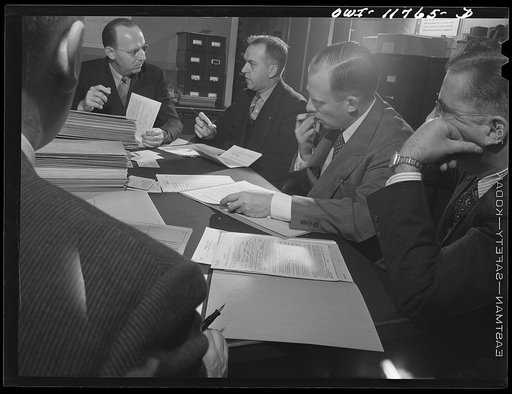 Ephrata, Lancaster County, Pennsylvania. Draft Board Number 5, which takes care of Lititz cases along with neighboring towns. Left to right: back to camera, A.L. Douple, Lititz banker; W.E. Buchholder (chairman), Justice of the Peace, and insurance and real estate man in Ephrata; Harold Shirker, ful