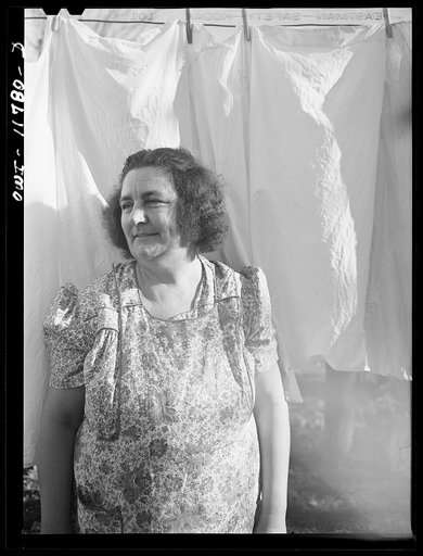 Lititz, Pennsylvania. Elizabeth Almoney, who has three sons and three brothers in the service, in her yard on Sunday
