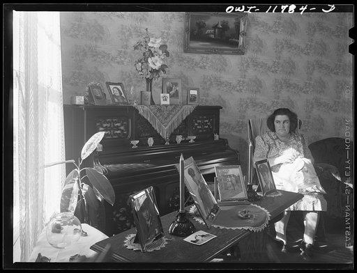 Untitled photo, possibly related to: Lititz, Pennsylvania. The Almoney family playing cards. Left to right: Arline, Edna, Arline's boyfriend Elvin Hanley who is nineteen and will be drafted in January, Mrs. A., Mr. A (back to camera)