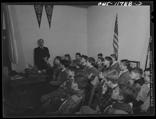 Untitled photo, possibly related to: Lititz, Pennsylvania. Raymond Runk, accountant at the Animal Trap Company and fire captain, giving a lecture on German bombs to Boy Scouts who are learning to be messengers. In emergencies, their duty would be to report fire bombs to the proper people