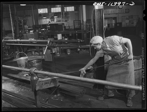 Lititz, Pennsylvania. Emma Dougherty, thirty-five, does a man's job, running an end-grinding machine, and gets same pay as a man. There are three girls in the factory who do this and they have all learned to set their own tools