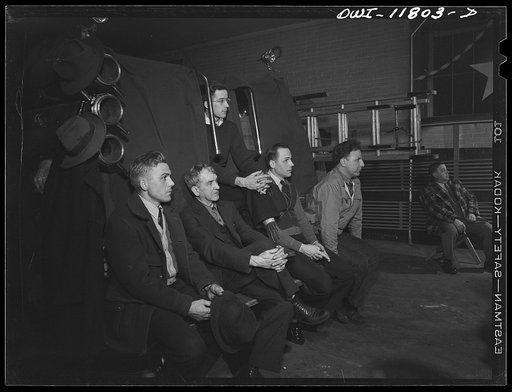 Lititz, Pennsylvania. Volunteer fire watchers, sitting on the fire engines in the fire house, listening to a lecture on the uses of gas in warfare given by Raymond Runk