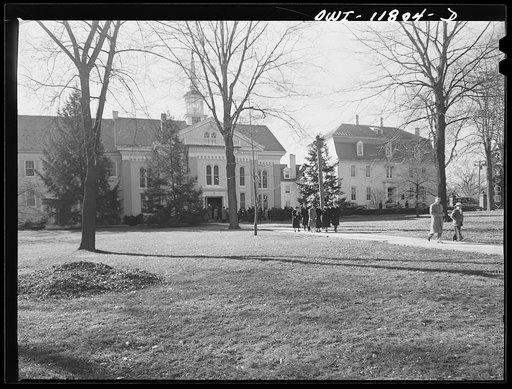 Lititz, Pennsylvania. People leaving the Moravian Church on Sunday. Moravians were the first settlers of Lititz. Their religion resembles that of the High Episcopalians. The Moravian Sunday school, at right, served as a hospital after the Battle of Brandywine Creek; is an emergency casualty center t