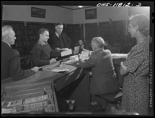 Lititz, Pennsylvania. Tire registration took place in the school library, supervised by principal M.C. Demmy. At right is the town librarian, Mrs. Searle