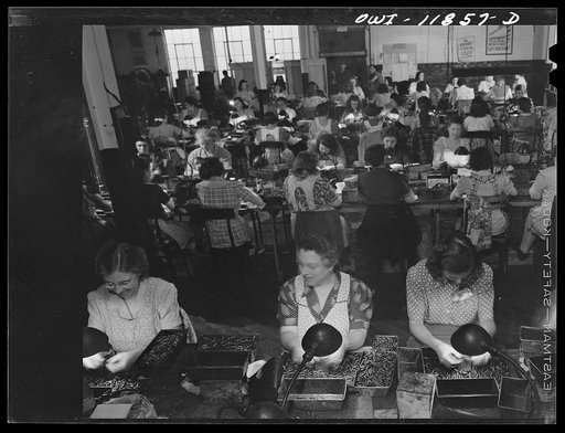 Untitled photo, possibly related to: Lititz, Pennsylvania. Gauge inspectors at the Animal Trap Company. Right front is Mrs. Julian Bachman, twenty-three, whose husband is in the Army