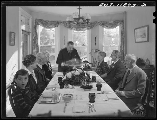 Untitled photo, possibly related to: Neffsville, Pennsylvania. Saying grace before carving the turkey at Thanksgiving dinner in the home of Earle Landis