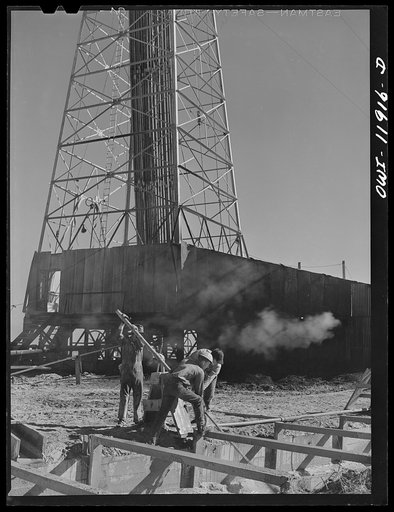 Andrews County, Texas. Mixing mud to be used in drilling operations