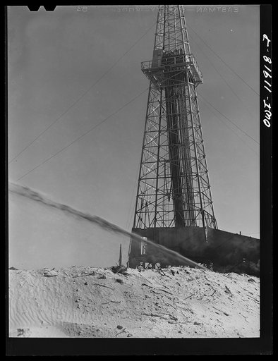 Untitled photo, possibly related to: Andrews County, Texas. Mixing mud to be used in drilling operations