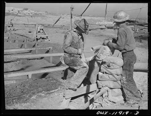 Untitled photo, possibly related to: Andrews County, Texas. Derrick builders at lunch