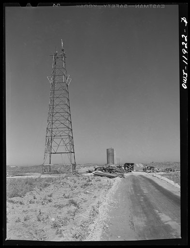 Andrews County, Texas. Derrick being erected
