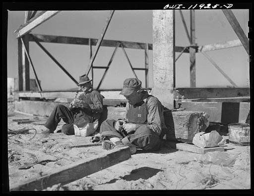 Untitled photo, possibly related to: Andrews County, Texas. Derrick builders at lunch