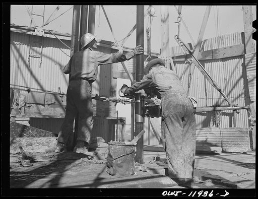 Untitled photo, possibly related to: Andrews County, Texas. Bit at end of drill pipe. In going through hard structures these bits sometimes wear out in three or four hours