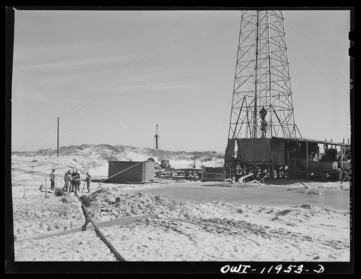 Andrews County, Texas. Bringing pipeline to new oil well