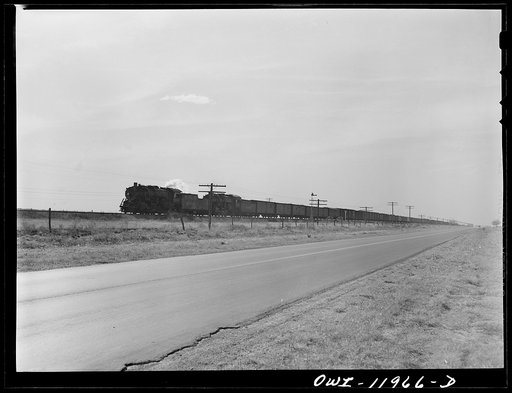 Untitled photo, possibly related to: Deaf Smith County, Texas. Train going across the Texas purchase