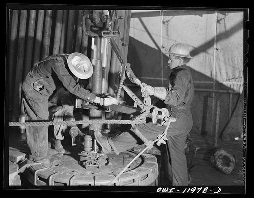 Andrews County, Texas. Pulling pipe out of hole in order to attach a new bit