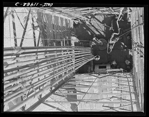 Andrews County, Texas. Looking down from the top of a derrick during drilling operation