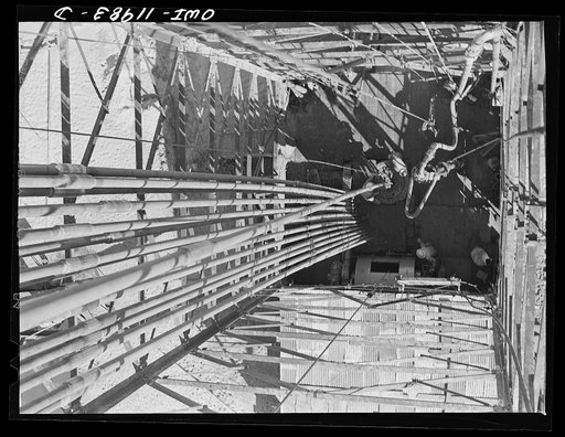 Untitled photo, possibly related to: Andrews County, Texas. Looking down from the top of a derrick during drilling operation