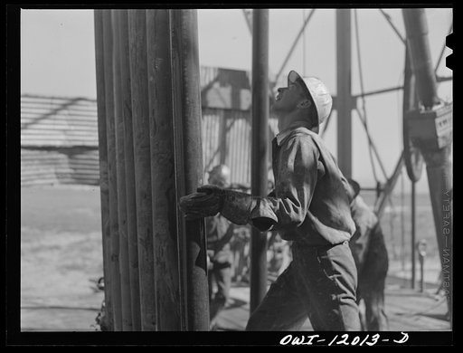 Untitled photo, possibly related to: Andrews County, Texas. Pulling up pipe to replace bit