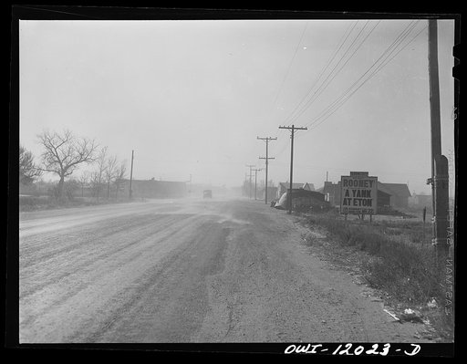 Untitled photo, possibly related to: Portales, New Mexico. Dust blowing on the street