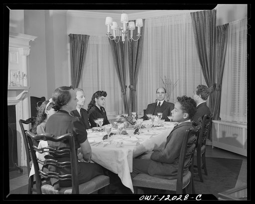 Untitled photo, possibly related to: Washington, D.C. Dr. Mordica [i.e. Mordecai] Johnson, president of Howard University, saying grace before Thanksgiving dinner