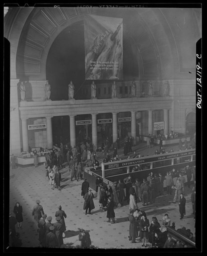 Untitled photo, possibly related to: Washington, D.C. Interior of the Union Station with an OWI (Office of War Information) banner in the background