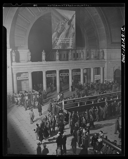 Washington, D.C. Interior of the Union Station with an OWI (Office of War Information) banner in the background