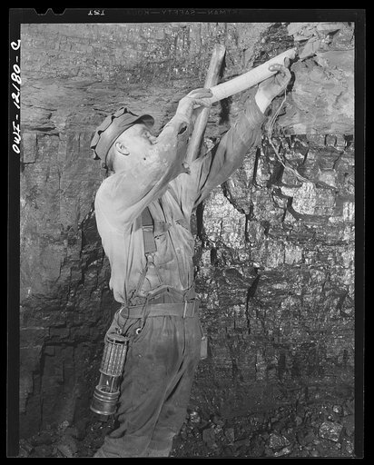 Pittsburgh, Pennsylvania (vicinity). Montour no. 4 mine of the Pittsburgh Coal Company. Tamping in sack of sand to increase the explosion force of a blast