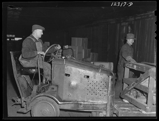 One of the "motors" used in the freight house at a Chicago and Northwestern Railroad yard for hauling hand dollies loaded with goods