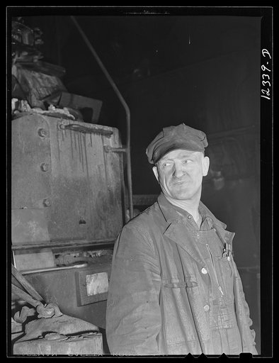 Chicago, Illinois. A workman employed at a roundhouse at a Chicago and Northwestern Railroad yard