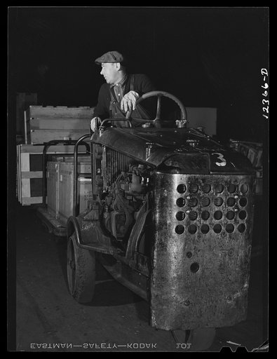 Chicago, Illinois. One of the "motors" used to haul dollies loaded with goods around the freight house at a Chicago and Northwestern Railroad yard