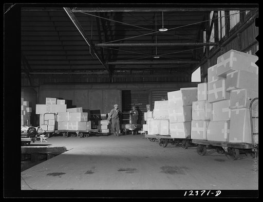 Chicago, Illinois. Unloading cars in the freight house at a Chicago and Northwestern Railroad yard