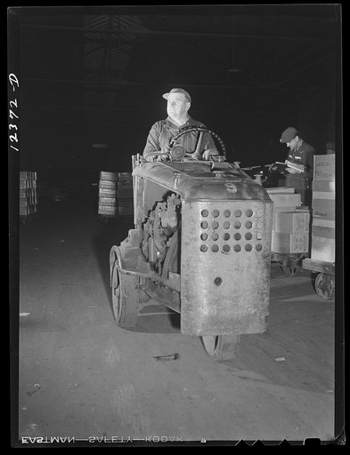 Chicago, Illinois. One of the "motors" used to haul dollies loaded with goods around the freight house at a Chicago and Northwestern Railroad yard