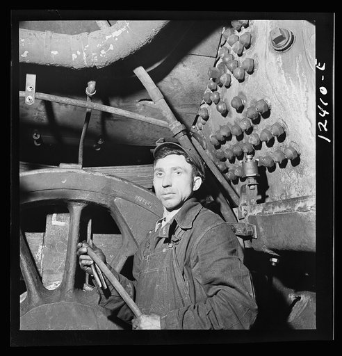 Chicago, Illinois. Railroad worker employed in the Chicago and Northwestern Railroad locomotive shops