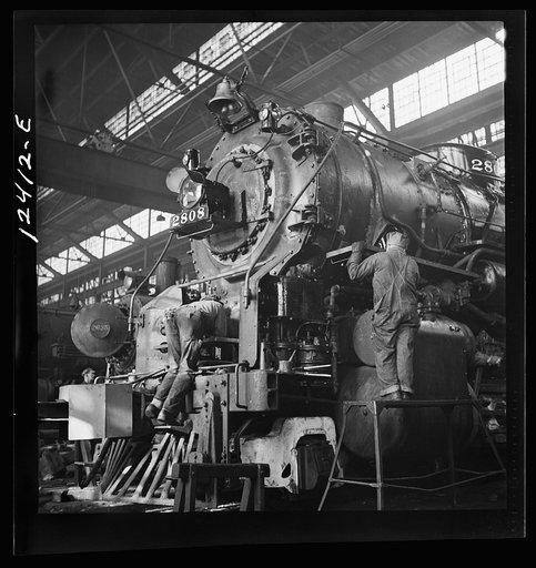 Chicago, Illinois. Locomotive under repair at the Chicago and Northwestern Railroad shops