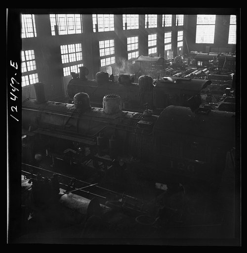 Untitled photo, possibly related to: Chicago, Illinois. In the Chicago and Northwestern Railroad locomotive repair shop